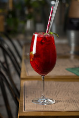Fresh fruit coctail on the table of restaurant cafe transparent with puffs