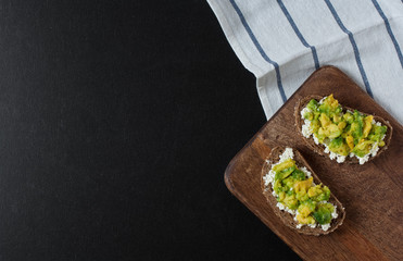Open sandwich with cottage cheese and avocado. Copy space