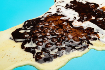 chocolate outer popsicle with beans melted complete on blue background