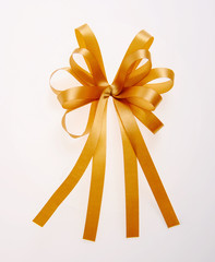 golden bows with long ribbon isolated