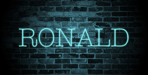 first name Ronald in blue neon on brick wall