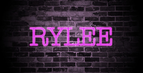 first name Rylee in pink neon on brick wall