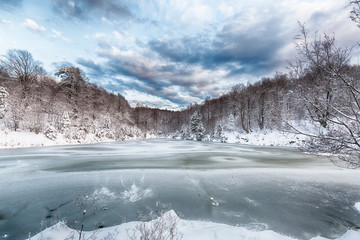 Frozen lake. Winter landscape.