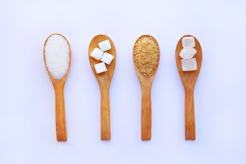 Various types of sugar on white.