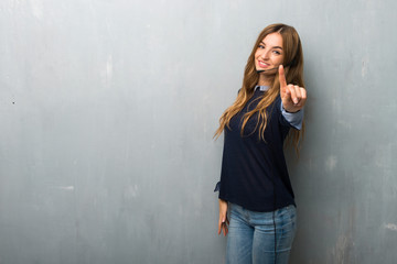 Telemarketer woman showing and lifting a finger