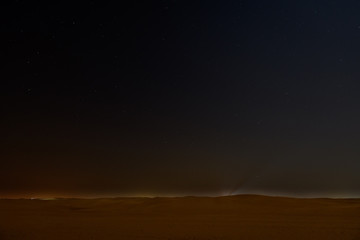 Night sky with stars above arabian desert