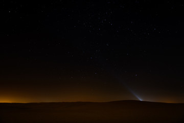 Night sky with stars above arabian desert