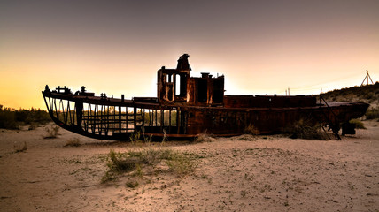 Panorama of ship cemetery at sunset near Moynaq, Karakalpakstan, Uzbekistan