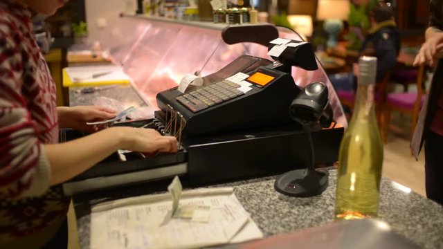 The Seller takes Money from the Client and closes the Cash Register