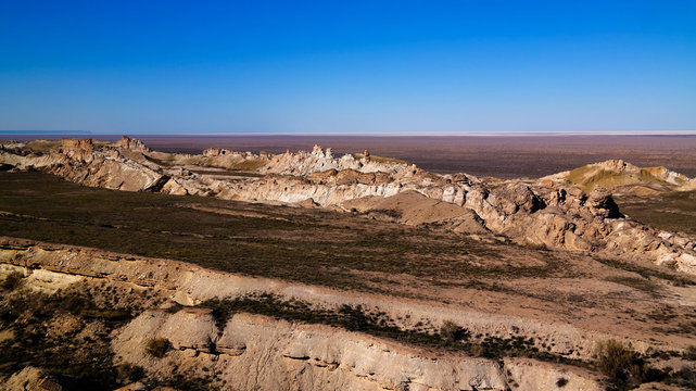 Panorama view to Aral sea from the rim of Plateau Ustyurt at sunset , Karakalpakstan, Uzbekistan