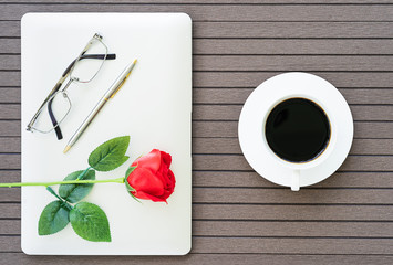 Coffee time with laptop,coffee cup,red rose
