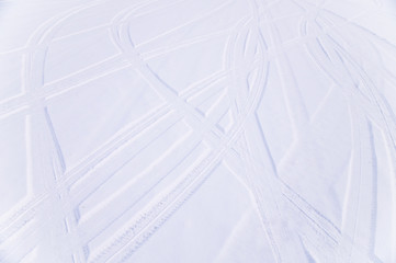 Traces of intersecting arcs of automobile tires in fresh snow
