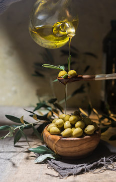 Virgin olive oil falling on a bowl