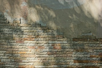 gray brown stone texture plaster and bricks in the old wall