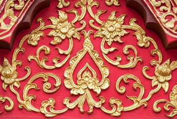 Floral stucco pattern with the golden paint.