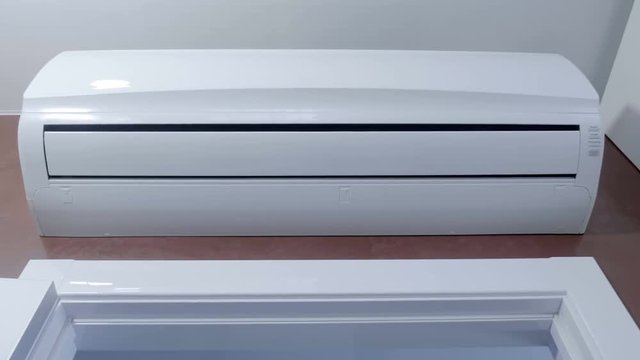 The internal unit of a powerful air conditioner above the door quickly reduces the temperature to a comfortable. Shot in motion