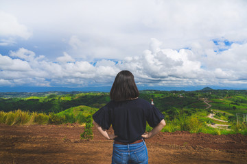 Happy young cute asian Japanese girl hipster backpack  women travelling looking at beautiful sky mountains scenery views 