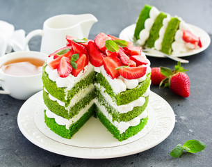 Cake with spinach, cream and strawberries. Valentine's Day.