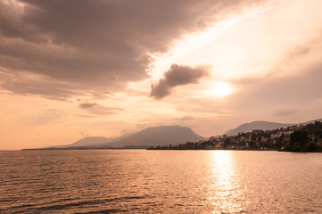 Naklejka premium Lake Neuchatel in beautiful evening sunset sky