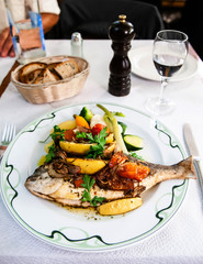 Fish dish - roasted fish, vegetables and lemon