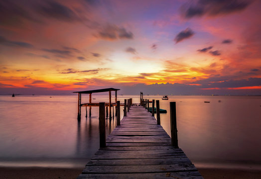 Landscape of Wooded bridge in the port between sunrise