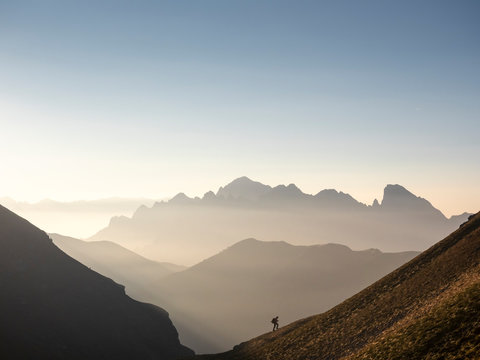Italy, Lombardy, Bergamasque Alps, hiker on the way to Passo del Gatto, Cima Bagozza and Mount Camino