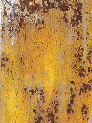 Rusty iron wall covered with paint