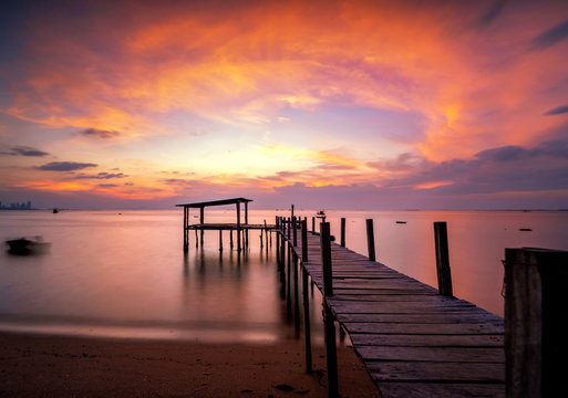 Landscape of Wooded bridge in the port between sunrise