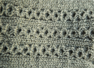 A beautiful closeup of a warm knitted pattern. Natural sheep wool yarn. Handcraft in bright colors.