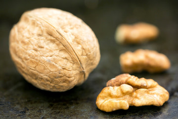 Healthy food concept, walnut with and without shell, closeup