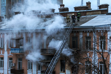 Odessa, Ukraine - Dec. 29, 2016: A fire in an apartment building. Strong bright light and clubs,...