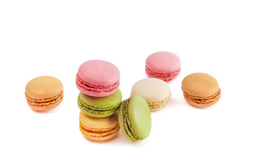 Decorative arrangement of macarons on white background