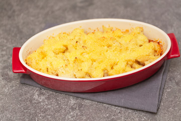 Cauliflower, tomatoes and cheese gratin in the baking dish
