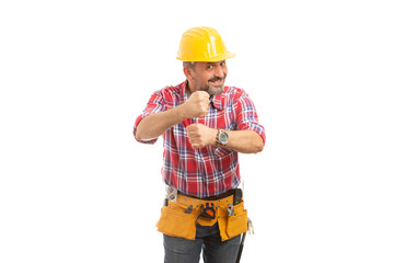 Builder holding up fists as mocking gesture.