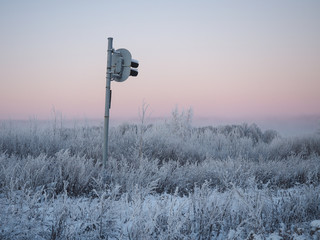 Strange railway traffic lights in icy field