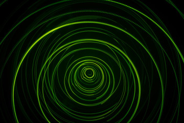 A beautiful, bright light swirl of green color. Futuristic light painting on a black background. Round light circles
