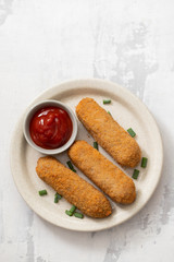 meat croquets with sauce on dish