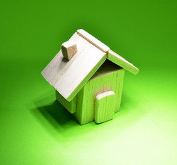 wooden house on green background