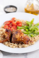 Fototapeta premium quinoa with chicken and vegetables on white plate