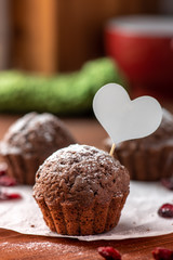 Chocolate muffin with a white heart.