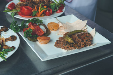 Turkish Paper Kebab (Kagit Kebap) served in a white plate