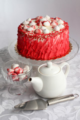 Red homemade cake decorated by hearts.