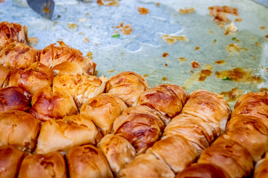 Turkish dessert "Baklava" with syrup in a tray