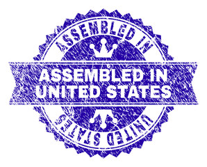 Obraz premium ASSEMBLED IN UNITED STATES rosette stamp seal imitation with distress texture. Designed with round rosette, ribbon and small crowns.
