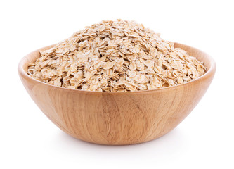 Oat flakes pile in bowl on white background