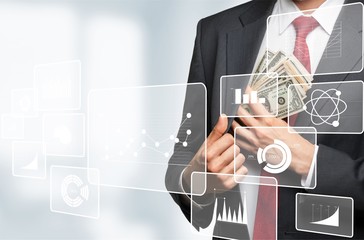 Businessman hiding dollars banknotes in the pocket of jacket