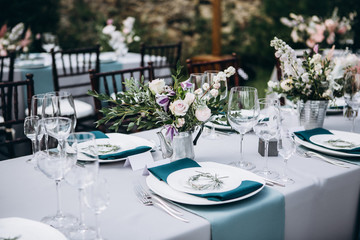 Wedding table decoration in rustic style. Wedding flowers.