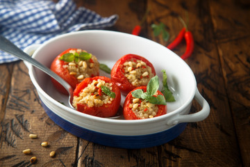 Quinoa stuffed tomatoes with pine nuts and basil