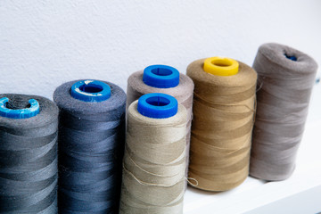 spools of colored thread in the workshop