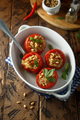 Quinoa stuffed tomatoes with pine nuts and basil